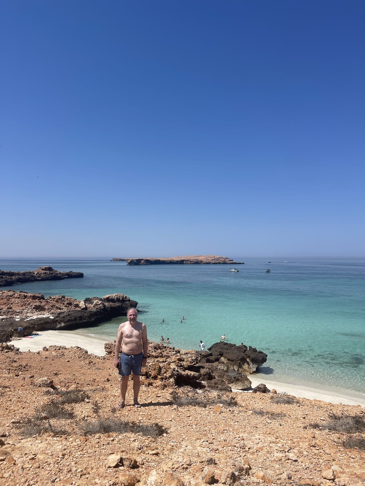 A guest taking in the view over the turquoise water at the Daymaniyat Islands