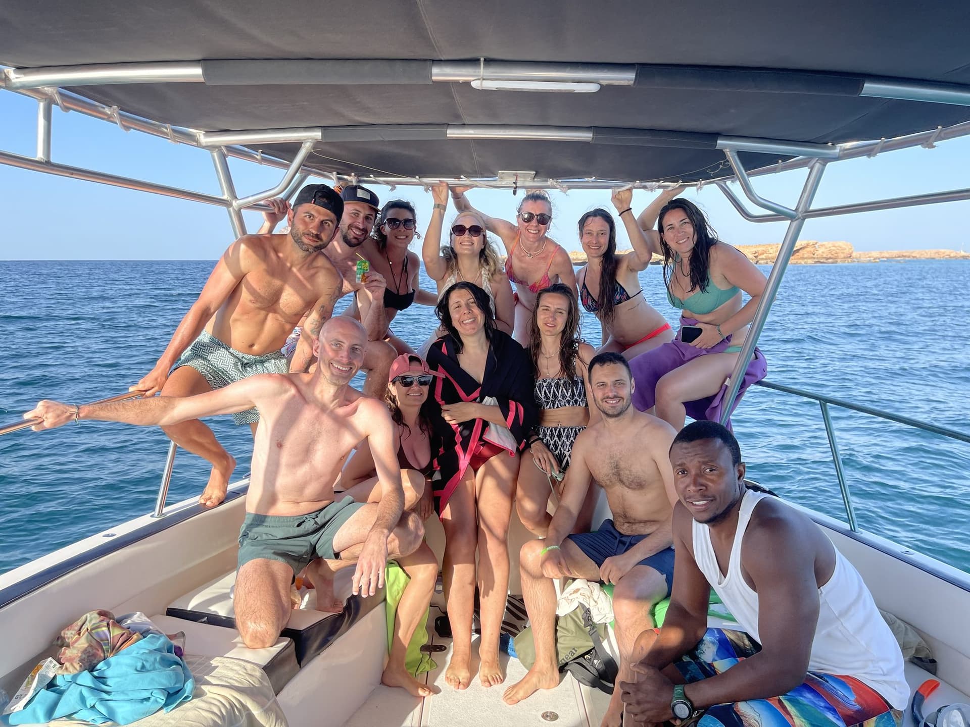 A happy group of guests aboard a Royal Marine Tours boat at the Daymaniyat Islands
